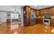 Traditional kitchen featuring stainless steel appliances, wood cabinets, and hardwood floors at 1840 N Brighton Cir, Mesa, AZ 85207