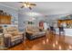 Open concept living room featuring hardwood floors and access to kitchen at 1840 N Brighton Cir, Mesa, AZ 85207