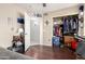 A bedroom featuring hardwood floors and a closet with sliding doors at 1847 E Milky Way, Gilbert, AZ 85295