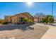 Inviting single-story home with desert landscaping, neutral tones, and an attached two car garage at 1847 E Milky Way, Gilbert, AZ 85295