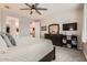 Inviting bedroom with a walk-in closet, dresser, and ceiling fan, creating a relaxing atmosphere at 18625 W Williams Rd, Surprise, AZ 85387