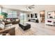 Spacious living room featuring wood flooring, a ceiling fan, and sliding glass doors at 18625 W Williams Rd, Surprise, AZ 85387