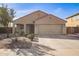 Charming single-story home featuring a two-car garage, low maintenance landscaping, and a welcoming entryway at 18637 W Fulton St, Goodyear, AZ 85338