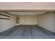 Spacious two-car garage with concrete flooring, a water heater, and a door to the inside at 18637 W Fulton St, Goodyear, AZ 85338