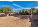 Large backyard featuring a gazebo, garden area, and mature trees at 1899 W Prospector Way, San Tan Valley, AZ 85144