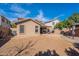 Backyard with a covered patio, gazebo, and an area ready for landscaping at 1899 W Prospector Way, San Tan Valley, AZ 85144