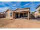 Inviting backyard featuring a covered patio with outdoor seating, a barbecue grill, and access to the yard at 1899 W Prospector Way, San Tan Valley, AZ 85144