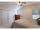 Bedroom has vaulted ceilings, ceiling fan, and a sliding glass door at 1899 W Prospector Way, San Tan Valley, AZ 85144