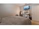 Bedroom features a TV, vanity with Hollywood lighting, and cozy decor at 1899 W Prospector Way, San Tan Valley, AZ 85144