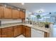 Traditional kitchen boasting granite countertops, white appliances, and oak cabinets at 1899 W Prospector Way, San Tan Valley, AZ 85144