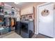 Laundry room with modern washer and dryer, storage shelves, and cabinet space at 1899 W Prospector Way, San Tan Valley, AZ 85144