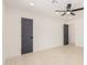 Spacious room featuring modern fixtures, tile flooring and neutral color palette at 19817 N Ponderosa Cir, Sun City, AZ 85373