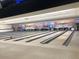 Bowling alley interior with multiple lanes, and desert-themed mural enhancing the recreational atmosphere at 19817 N Ponderosa Cir, Sun City, AZ 85373