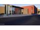 Community center entrance featuring modern architecture, glass doors and welcoming landscape at 19817 N Ponderosa Cir, Sun City, AZ 85373