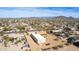 Expansive aerial view of a desert community with mountain views, showcasing the neighborhood's layout and landscaping at 205 E Irvine Rd, Phoenix, AZ 85086