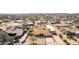 View of desert home and shop building, with lots of parking on a large flat parcel in a small, sparse community at 205 E Irvine Rd, Phoenix, AZ 85086