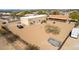 Expansive property featuring main house and sizable warehouse, ideal for diverse residential or commercial uses at 205 E Irvine Rd, Phoenix, AZ 85086