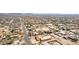 Panoramic aerial of a sprawling desert community with well-spaced homes and native vegetation, under a sunny sky at 205 E Irvine Rd, Phoenix, AZ 85086