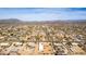 An aerial view of a vast residential area, highlighting the community's layout and the surrounding desert landscape at 205 E Irvine Rd, Phoenix, AZ 85086