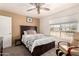 Comfortable bedroom featuring natural light from the window and carpet flooring throughout at 205 E Irvine Rd, Phoenix, AZ 85086