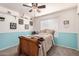 Cozy bedroom with decorative shelving and a comfortable bed, perfect for relaxation at 205 E Irvine Rd, Phoenix, AZ 85086