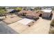 Aerial view features desert landscaped yard, and a spacious three-car garage, on a single-Gathering house at 205 E Irvine Rd, Phoenix, AZ 85086