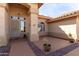 Charming covered front porch with security screen door and decorative landscaping at 205 E Irvine Rd, Phoenix, AZ 85086