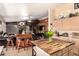 Open-concept kitchen featuring a breakfast bar and a stone fireplace in the adjacent living area at 205 E Irvine Rd, Phoenix, AZ 85086