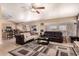 Spacious living room with vaulted ceiling, comfortable seating, and seamless access to a modern kitchen at 205 E Irvine Rd, Phoenix, AZ 85086