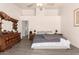 Large main bedroom with vaulted ceilings and a modern ceiling fan at 205 E Irvine Rd, Phoenix, AZ 85086