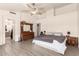 Large main bedroom with vaulted ceiling, ceiling fan, and wood-look floors at 205 E Irvine Rd, Phoenix, AZ 85086