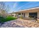 Expansive back patio with flagstone and decorative concrete providing ample space for outdoor seating and dining at 2125 W Berridge Ln, Phoenix, AZ 85015