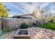 Backyard with a built-in firepit, perfect for gathering with friends and enjoying the outdoors at 2125 W Berridge Ln, Phoenix, AZ 85015