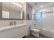 Modern bathroom with stylish white vanity, frameless glass shower, and sleek fixtures for a spa-like retreat at 2125 W Berridge Ln, Phoenix, AZ 85015