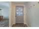 Inviting entryway featuring a decorative glass door and convenient coat hooks at 2125 W Berridge Ln, Phoenix, AZ 85015