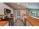 Well-lit kitchen boasting butcher block countertops, white cabinets, stainless steel appliances, and decorative backsplash at 2125 W Berridge Ln, Phoenix, AZ 85015