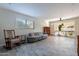 Spacious living area featuring tile flooring, ample natural light, and comfortable seating at 2125 W Berridge Ln, Phoenix, AZ 85015