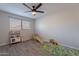 Bright playroom with toys, a rug, and a window offers a fun and stimulating area for children at 2125 W Berridge Ln, Phoenix, AZ 85015