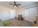 Cheerful playroom features light-colored walls, wood-look floors, and a closet, perfect for to play at 2125 W Berridge Ln, Phoenix, AZ 85015