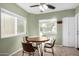 Cozy breakfast nook with tile floor, ceiling fan, and bright windows perfect for morning coffee at 2129 N Apollo Ct, Chandler, AZ 85224