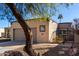 Charming single-story home with desert landscaping, private gate and attached two-car garage at 2129 N Apollo Ct, Chandler, AZ 85224