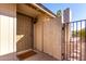 Covered front entry with stylish door and secure gated access at 2129 N Apollo Ct, Chandler, AZ 85224