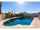 Sparkling pool with palm tree landscaping, perfect for relaxation and outdoor entertaining at 2129 N Apollo Ct, Chandler, AZ 85224