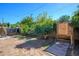 Backyard with mature trees and a wooden platform for playing games at 2217 N 37Th Pl, Phoenix, AZ 85008