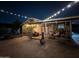 Backyard featuring covered patio with furniture and string lights at 2217 N 37Th Pl, Phoenix, AZ 85008