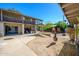 Expansive backyard featuring a spacious patio, rustic chiminea, and vibrant green foliage at 2217 N 37Th Pl, Phoenix, AZ 85008