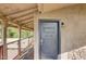 This balcony features a grey door and a scenic view of the surrounding trees at 2217 N 37Th Pl, Phoenix, AZ 85008