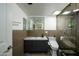 Modern bathroom with updated fixtures, a stylish vanity, and elegant tiling at 2217 N 37Th Pl, Phoenix, AZ 85008