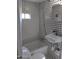 Small bathroom featuring black and white geometric tiles, tub and shower at 2217 N 37Th Pl, Phoenix, AZ 85008