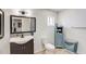 Bathroom featuring a modern vanity, toilet, and stylish mirror at 2217 N 37Th Pl, Phoenix, AZ 85008